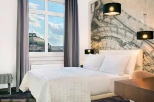 Postel nebo postele na pokoji v ubytování Le Méridien Grand Hotel Nürnberg