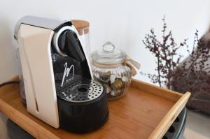 a toaster sitting on top of a wooden tray at Kala House - BRAND NEW!! in Zadar