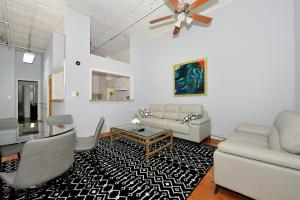 a living room with a couch and a table at Beautiful 4BR 1Bath in Chamber Street NYC in New York