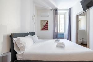 Postel nebo postele na pokoji v ubytování VG [ROME CENTER] Garibaldi Room