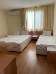 a room with two beds and a window at Комплекс за гости Малки Воден in Malki Voden +40 photos