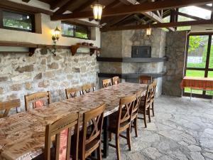 a large dining room with a large table and chairs at Комплекс за гости Малки Воден in Malki Voden