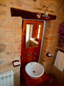 a bathroom with a sink and a mirror at Casa Bacci in Siena