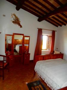 a bedroom with a bed and a large mirror at Casa Bacci in Siena +21 photos