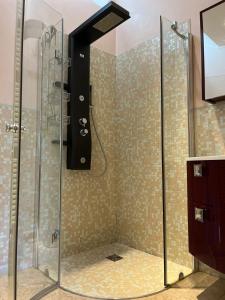 a shower with a glass enclosure in a bathroom at La Terrazza Sul Lago in Ossuccio