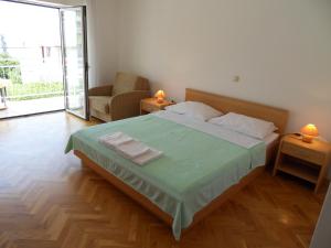 Posteľ alebo postele v izbe v ubytovaní Apartments Petricevic