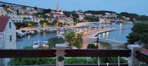 a view of a river with boats in a town at Studio Apartment Riva in Sumartin