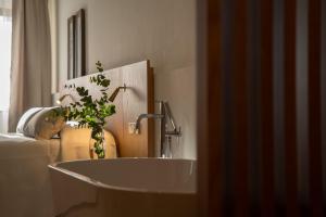 Postel nebo postele na pokoji v ubytování Nema Boutique Hotel & Spa