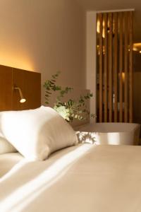 Postel nebo postele na pokoji v ubytování Nema Boutique Hotel & Spa