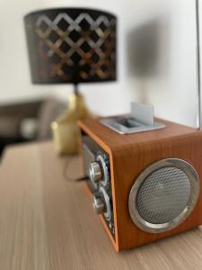a small brown radio sitting on top of a table at Apartmán Lodenica in Piešťany