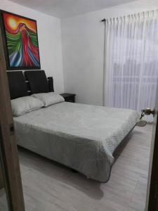 Posteľ alebo postele v izbe v ubytovaní Acogedor Apartamento central.
