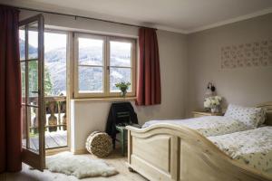 Postelja oz. postelje v sobi nastanitve Alpengasthof Karalm