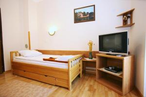 Łóżko lub łóżka w pokoju w obiekcie Trim Apartments