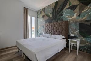 Postel nebo postele na pokoji v ubytování Hotel President + 37 fotografií