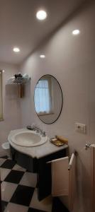 a bathroom with a sink and a mirror at Hotel Excelsior in Lanciano