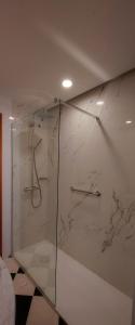 a bathroom with a shower with a glass door at Hotel Excelsior in Lanciano
