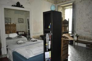 Llit o llits en una habitació de Dimora Storia