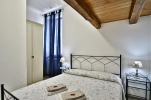 Llit o llits en una habitació de appartamento cielo&terra2