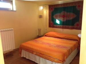Postel nebo postele na pokoji v ubytování Il soffio di Eolo