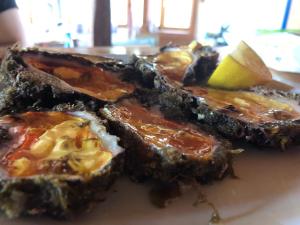 a close up of a plate of food on a table at Gregory's Village in Platy +37 photos