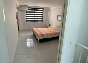 Krevet ili kreveti u jedinici u objektu Nueva y Confortable Casa en Sector Popular