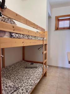 Postel nebo postele na pokoji v ubytování BeachFront Rooms Marina di Ragusa