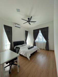 a bedroom with a bed and a ceiling fan at De France Pool Villa Mu5lim Only in Malacca