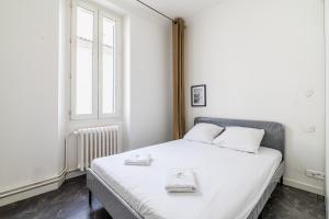 Posteľ alebo postele v izbe v ubytovaní Maison de ville pour 7 personnes