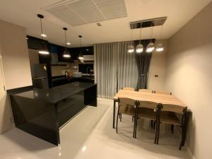 a kitchen and dining room with a table and chairs at Townhouse near Donmuang airport 4 bedrooms in Bangkok