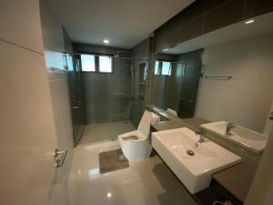 a bathroom with a sink and a shower and a toilet at Townhouse near Donmuang airport 4 bedrooms in Bangkok