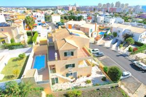 an aerial view of a house in a city at Olival Beach Villa with Pool walking distance to Beach in Armação de Pêra