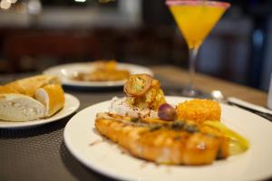 a table with plates of food and a glass of orange juice at ONOMO Hotel Tanger Med in Tangier