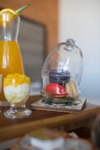 a table with a glass jar and a bowl of food at ONOMO Hotel Tanger Med in Tangier
