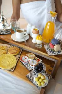 a tray of breakfast foods and coffee on a table at ONOMO Hotel Tanger Med in Tangier