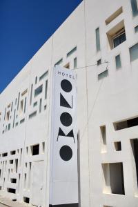 a hotel sign on the side of a building at ONOMO Hotel Tanger Med in Tangier