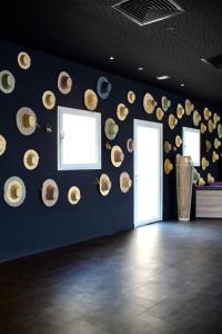 a room with a bunch of hats on the wall at ONOMO Hotel Tanger Med in Tangier