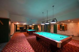 a billiard room with two pool tables in it at Hotel Kurucesme Business in Istanbul