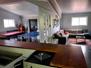 a living room with a couch and a table at Casa Monte da Eira in Giões