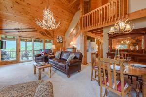 a living room with a couch and a table at Valle View in Valle Crucis