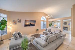 a living room with a couch and a table at Sunset Swim - Modern Vegas Heated Pool Retreat in Las Vegas