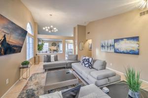 a living room with a couch and a table at Sunset Swim - Modern Vegas Heated Pool Retreat in Las Vegas