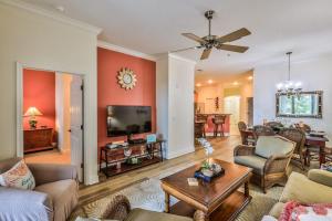 a living room filled with furniture and a flat screen tv at Hammock Beach 2BD 2BR Villa! Walk to the Ocean! in Palm Coast