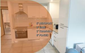a kitchen with white cabinets and a sign that reads adaptor garage at Appartements renové 2023 proche aéroport 5min, gare sncf 2 min, tramway au pied de l'immeuble , Parking possible, Renovated apartments 2023 near the airport 5 min, train station 2 min, tram next to the building 1 min, Parking possible in Nice