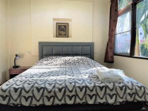 Postel nebo postele na pokoji v ubytování Golf-Sea-City Guest House