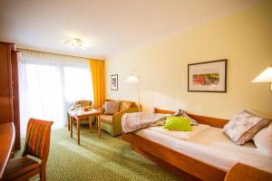 Postel nebo postele na pokoji v ubytování Hotel Konradshof