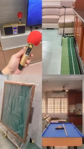 a room with a table with a remote control in it at Pool Villa Max Bath Tub BBQ Steamboat Party 5Bedroom 23Pax Full Airconditioned in Melaka