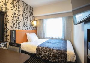 Postel nebo postele na pokoji v ubytování APA Hotel Namba Shinsaibashi + 37 fotografií