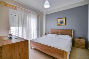 Кровать или кровати в номере Natalia Apartments