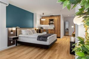 Postel nebo postele na pokoji v ubytování Uni88 Apart Hotel