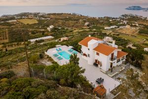an aerial view of a house with a swimming pool at Villa Aura Pine in Agia Pelagia